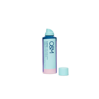 O&M hair Shine serum spray bottle on a white background, lid off